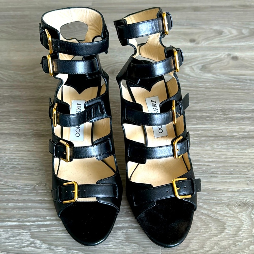 Jimmy Choo black heels with gold buckles. Size 40. Heel height 4 inches.
